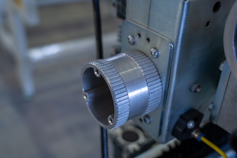 Rigid metal coupling on an industrial gearbox.