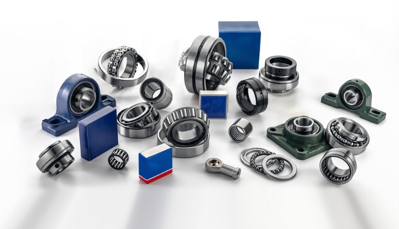Various types of industrial bearings and mechanical parts are displayed in an organized manner, showcasing their forms and functions ideal for engineering projects and repairs.